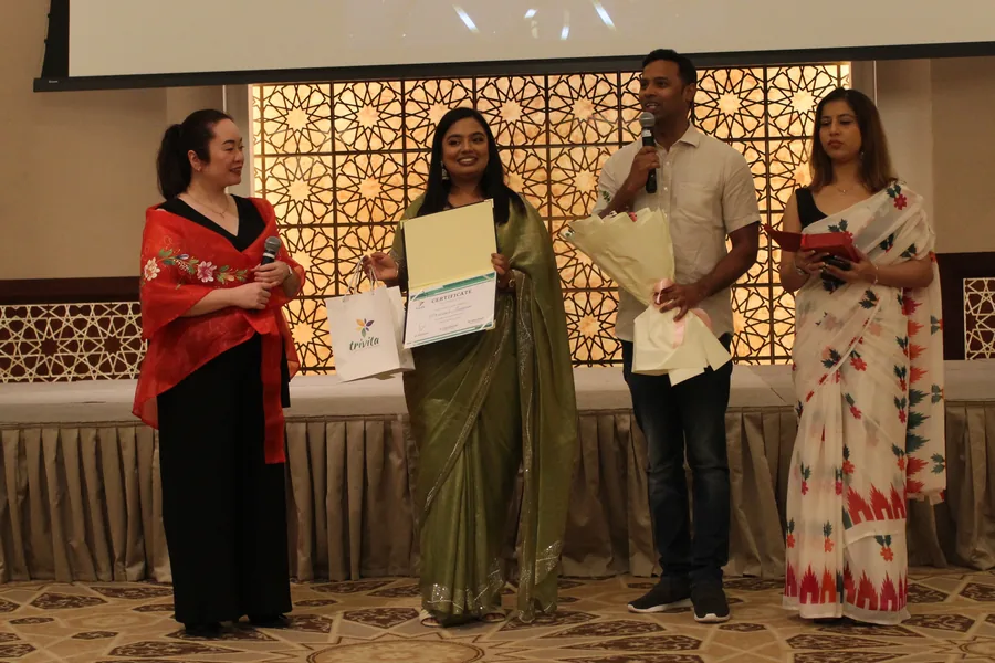 Colleagues receiving recognition awards at the Trivita second anniversary event